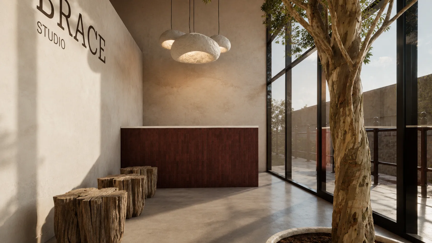 Recepción de Brace Studio con barra de azulejo granate, lámparas de piedra y ventanal a la terraza.